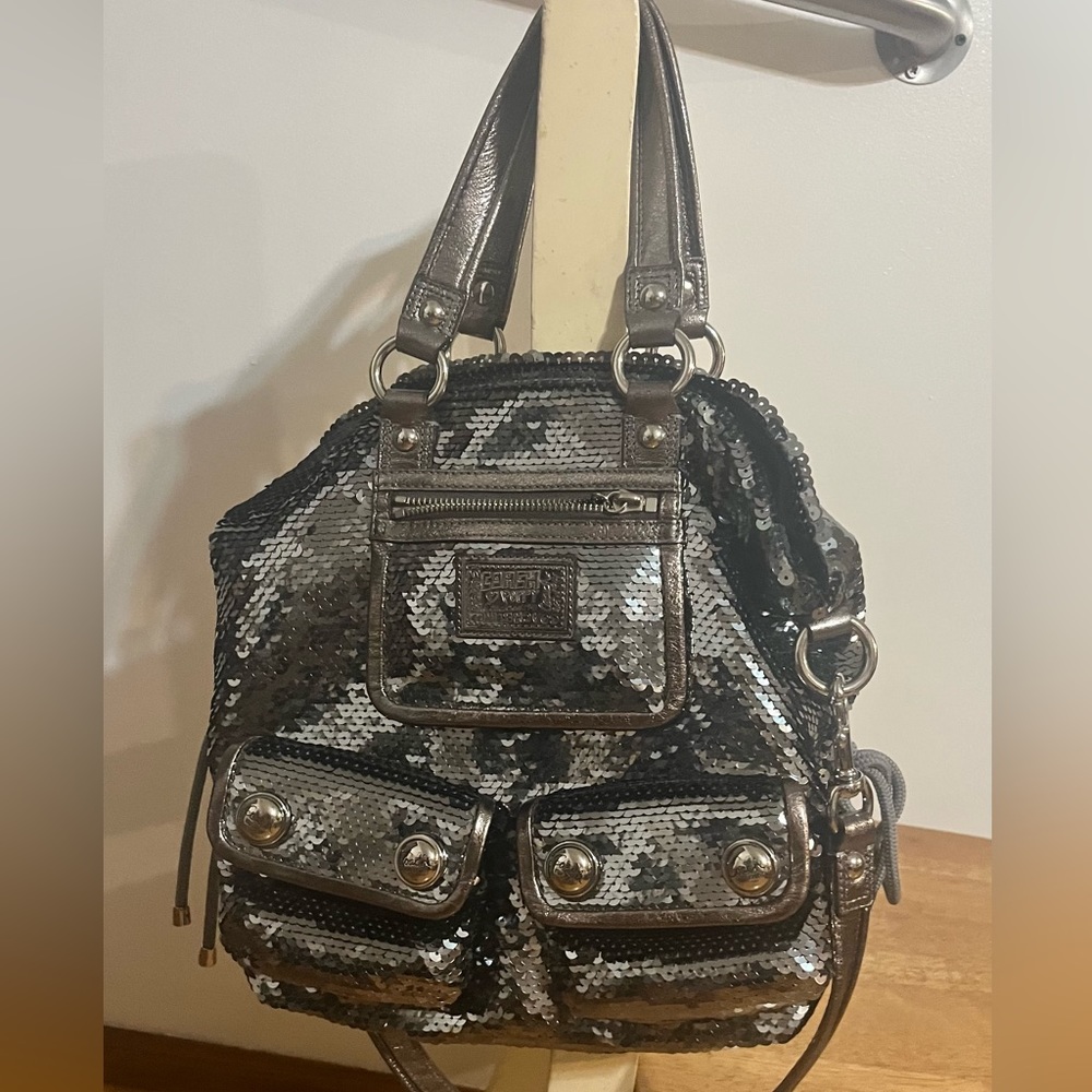 Coach poppy sequin purse like new. Adorable purple lined interior.